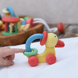 Nic organic grip duck wooden push along baby toy being pushed along. 