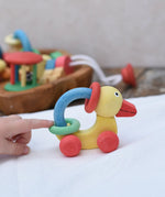 Nic organic grip duck wooden push along baby toy being pushed along. 