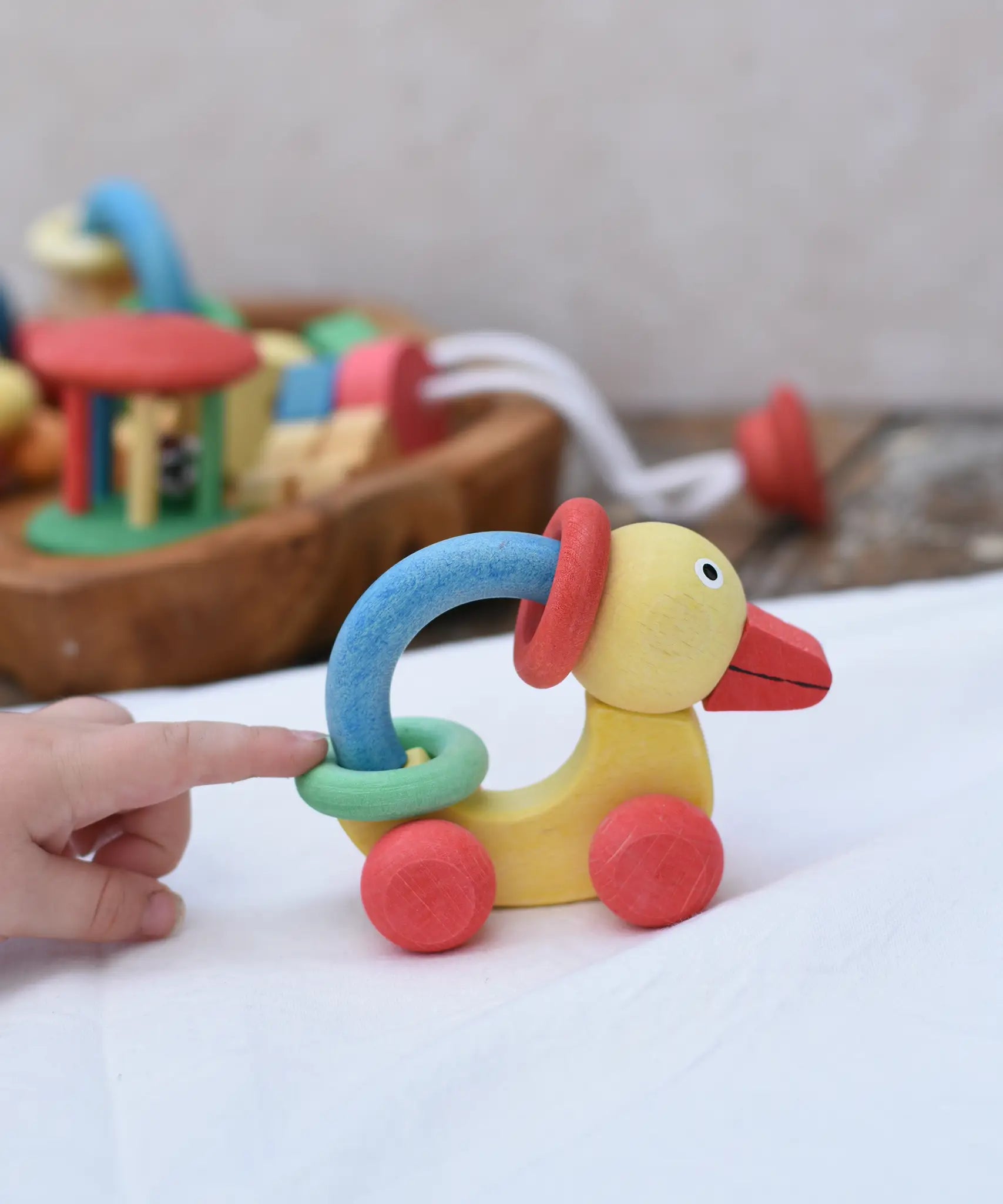 Nic organic grip duck wooden push along baby toy being pushed along. 