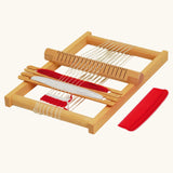 Nic Wooden Susi Weaving Frame pictured with read and white yarn.