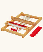 Nic Wooden Susi Weaving Frame pictured with read and white yarn.