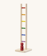 Nic Toys wooden colourful climbing ladder. A tumbling style toy with multicoloured ladder rungs and a red peg doll.