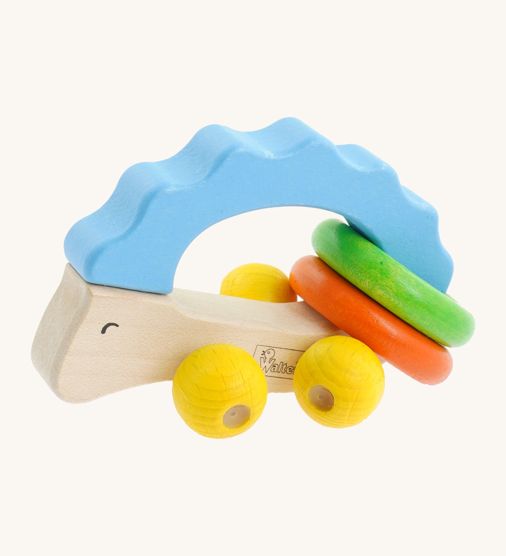 Nic Toys wooden hedgehog grasper. Features yellow grasper balls representing the feet with green and orange rings around it's body for rattling 