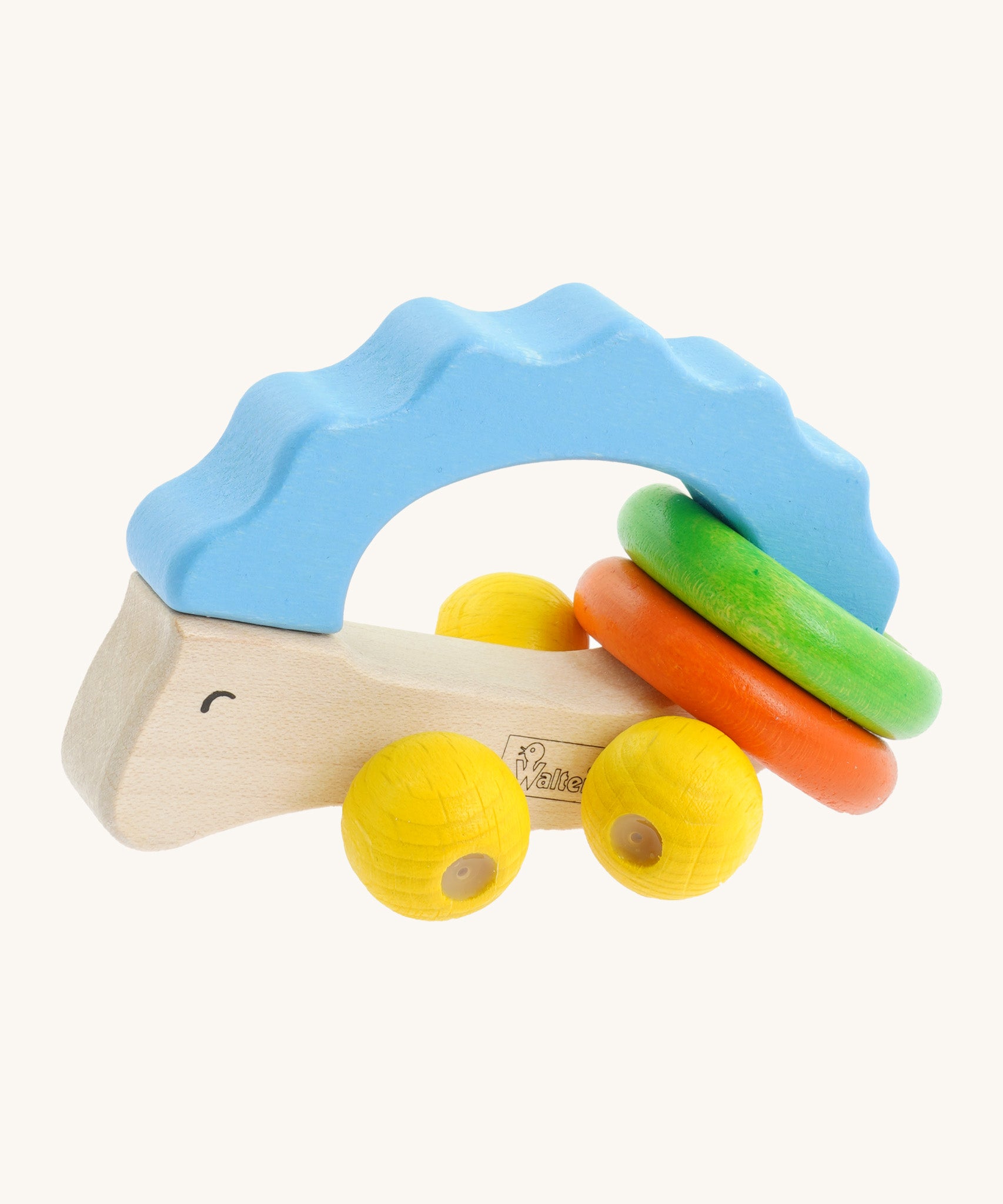 Nic Toys wooden hedgehog grasper. Features yellow grasper balls representing the feet with green and orange rings around it's body for rattling 