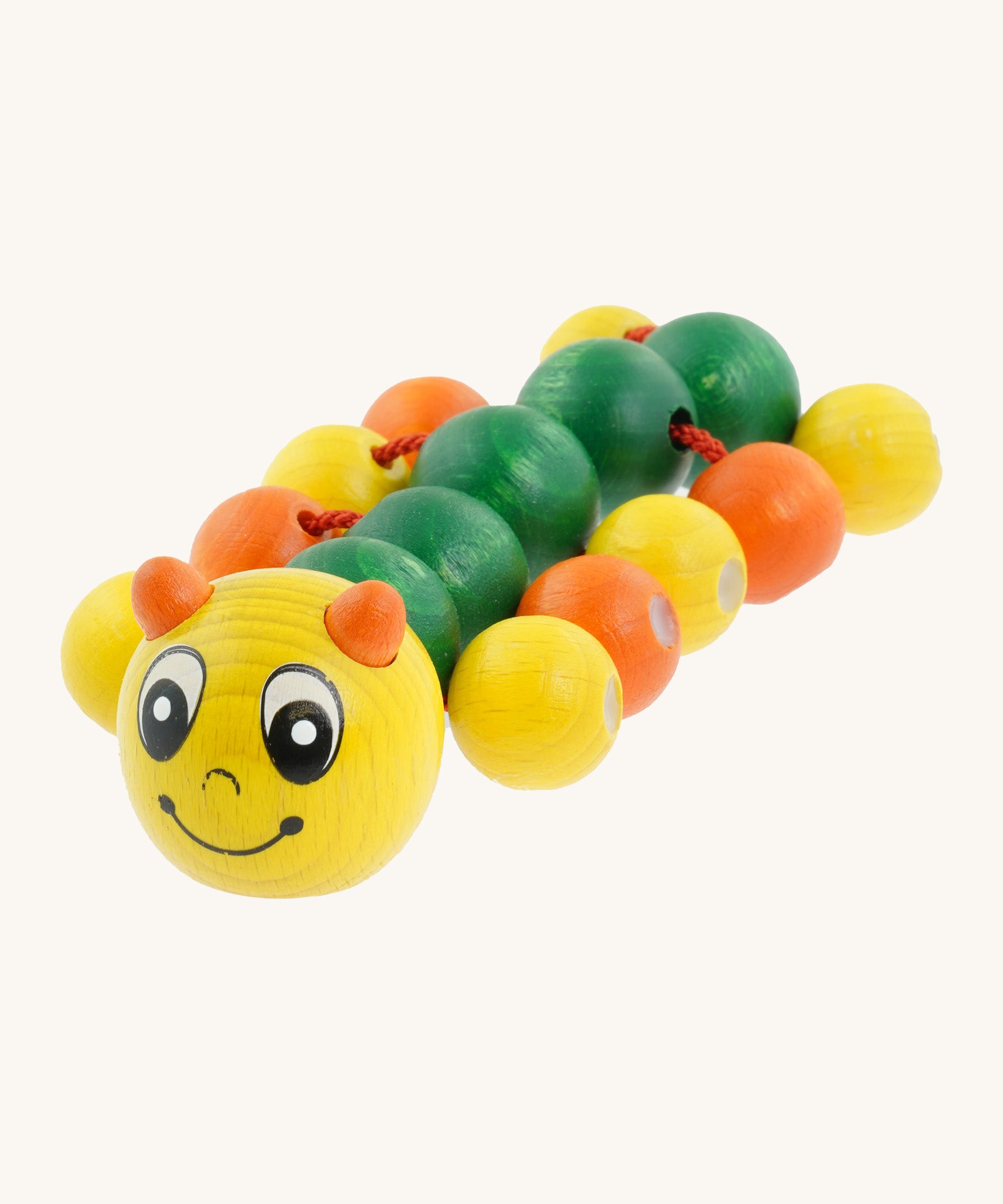 Nic Toys wooden molly the caterpillar grasping toy. Features a yellow and green body with grasping beads representing the feet.