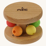 Nic Toys wooden rolling rattle laid flat, features multicoloured beads for grasping and brand name on the side disk
