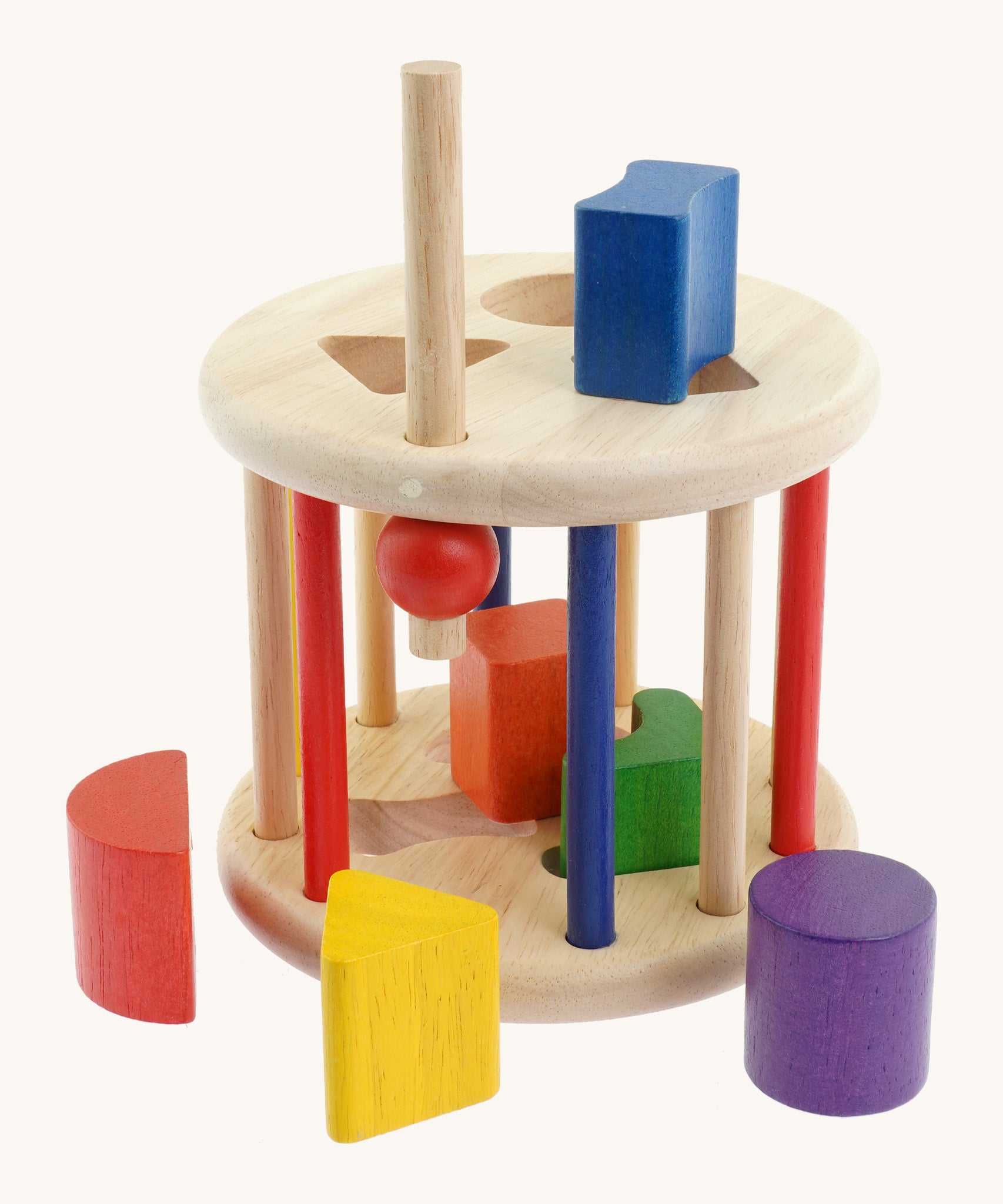 Nic Toys rolling sorter. Features different coloured wooden blocks in different shapes to fit in the cut out holes on the roller with a opening for easy access