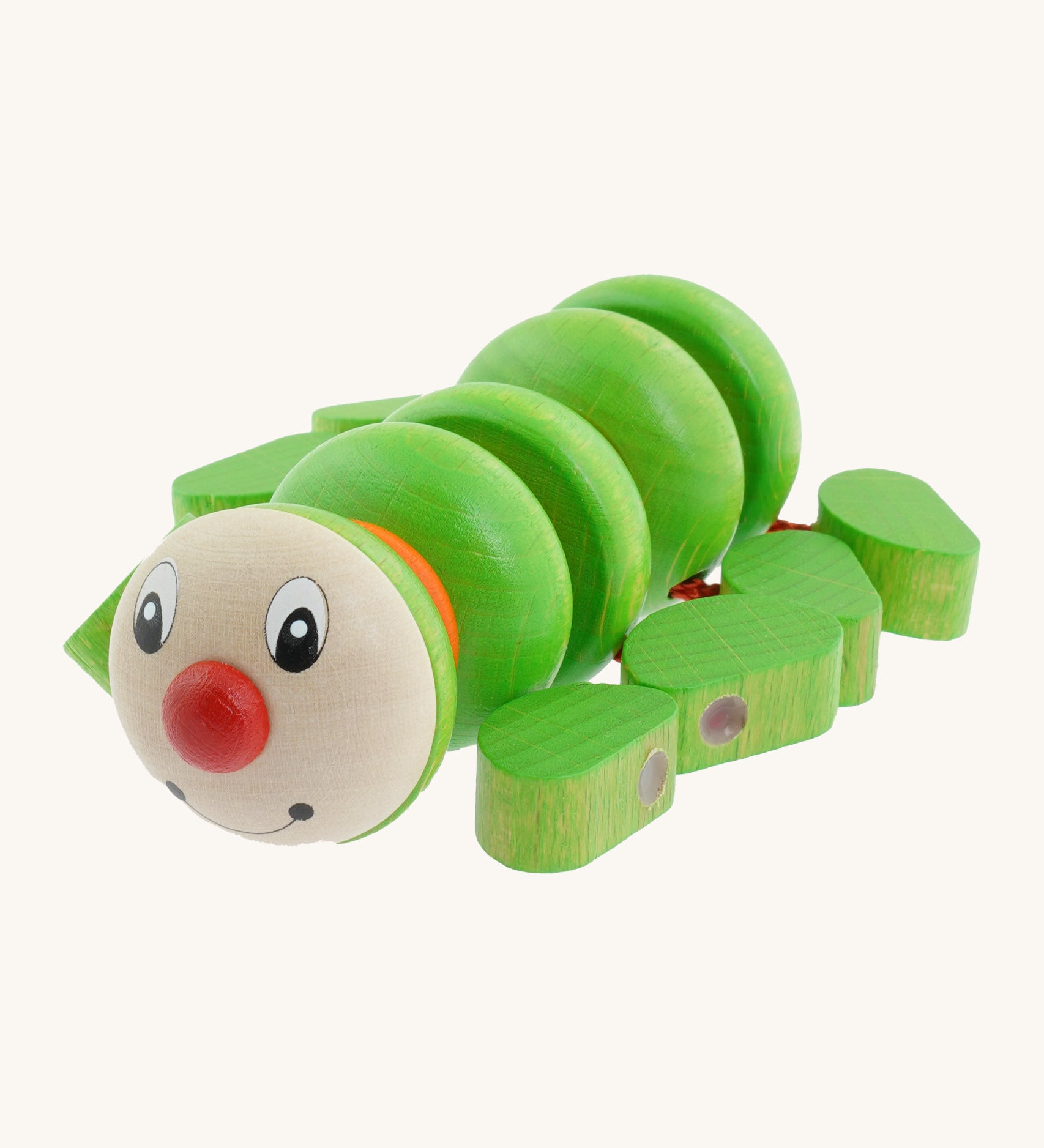 Nic Toys wooden Willy the centipede grasper. Features little green blocks as feed and a playful face with a red nose.