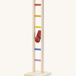 Nic Toys wooden colourful climbing ladder in play showing the red peg doll tumbling down the ladder.