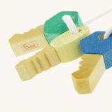 A close up of the Nic Toys wooden grasping keyring set available at showing the cut detail on the keys and brand logo