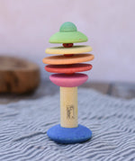 Nic Toys wooden rattling tree baby toy. Coloured disks for making a noise and a wooden handle for grip.