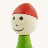 A close up of the Nic toys wooden gnome tumbler available at Babipur showing the hand painted facial features
