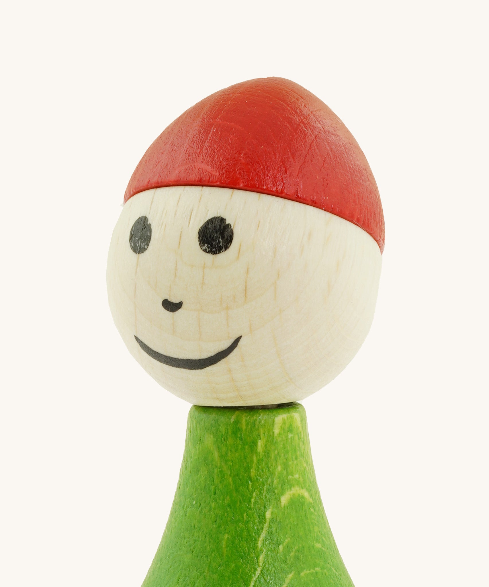 A close up of the Nic toys wooden gnome tumbler available at Babipur showing the hand painted facial features