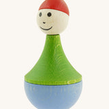 Nic toys wooden gnome tumbler available at Babipur. A weighted wooden toy with a green top, light blue bottom and a red hat. Features playful facial features