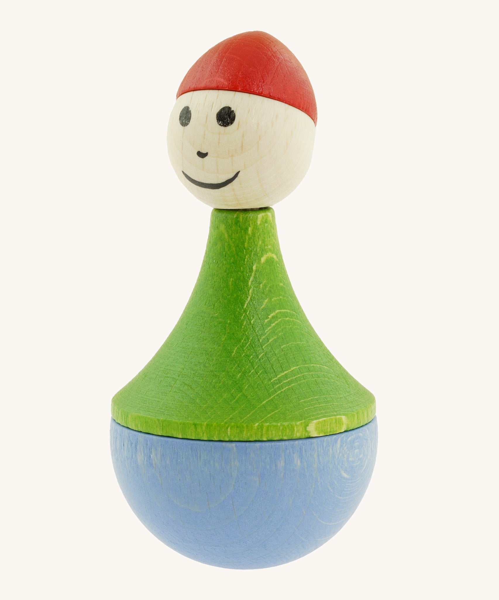 Nic toys wooden gnome tumbler available at Babipur. A weighted wooden toy with a green top, light blue bottom and a red hat. Features playful facial features