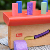 Close up of the Walter logo on the side of the Nic Walter bio organic wooden pounding bench children's toy.