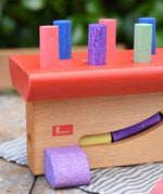 Close up of the Walter logo on the side of the Nic Walter bio organic wooden pounding bench children's toy.