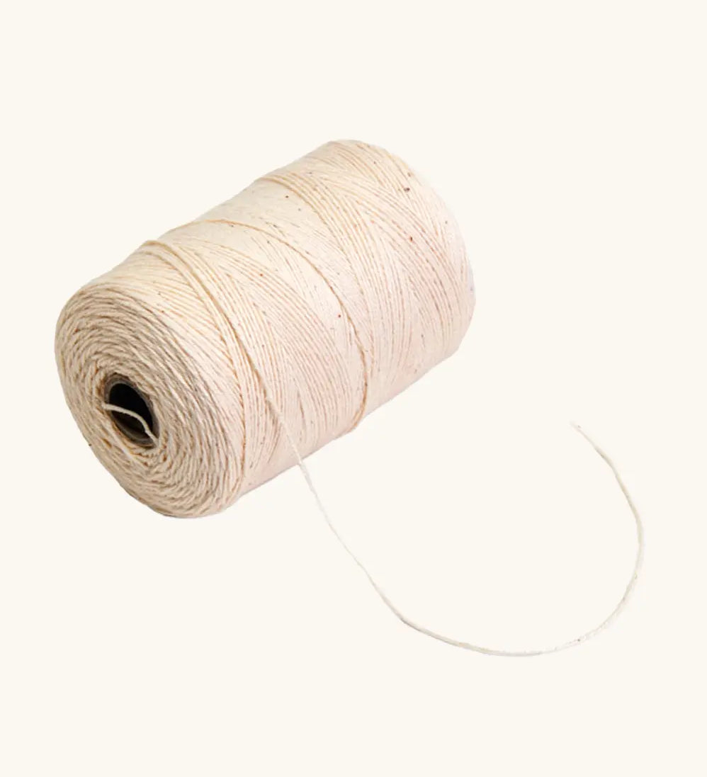 Nic Warp Weaving Yarn 100g, spool of light beige yarn.