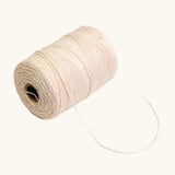 Nic Warp Weaving Yarn 100g, spool of light beige yarn.