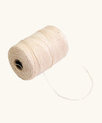 Nic Warp Weaving Yarn 100g, spool of light beige yarn.