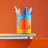 Ocelot Blood Orange Organic Drinking Chocolate tin repurposed and used as a pen pot.
