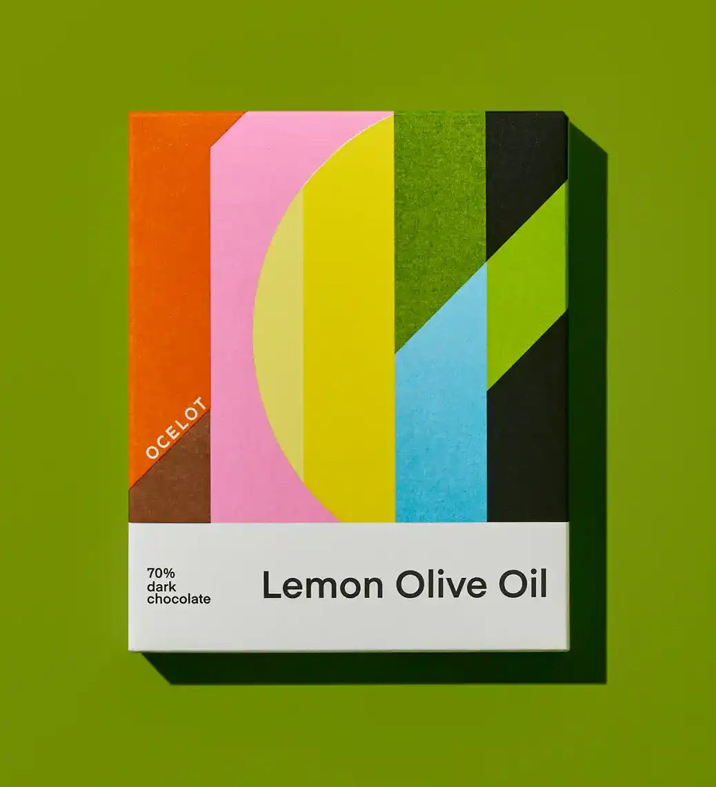 Ocelot Lemon Olive Oil Organic 70% Dark Chocolate in a box featuring a geometric style design.