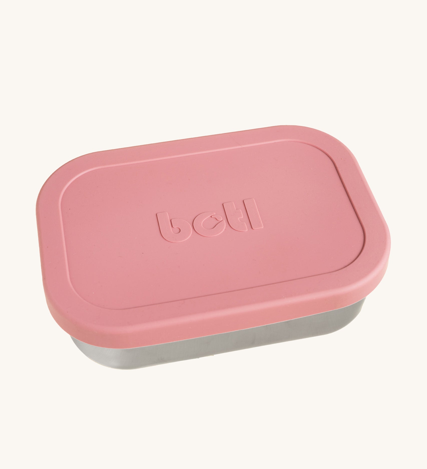 A One Green Bottle lunchbox in rose colour. A stainless steel plastic free lunchbox available at Bapipur. Features a pale pink silicone lid. 