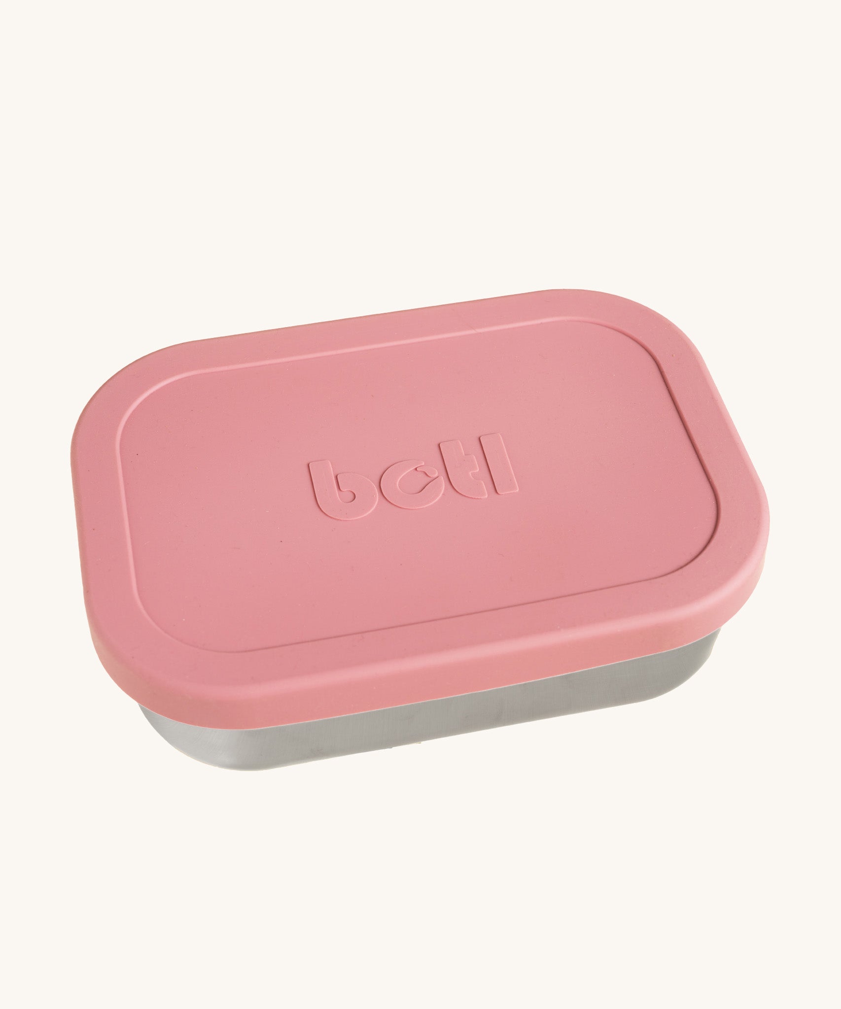 A One Green Bottle lunchbox in rose colour. A stainless steel plastic free lunchbox available at Bapipur. Features a pale pink silicone lid. 