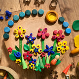 Flowers created using the OkoNorm play dough decorated with Grapat mandala pieces.