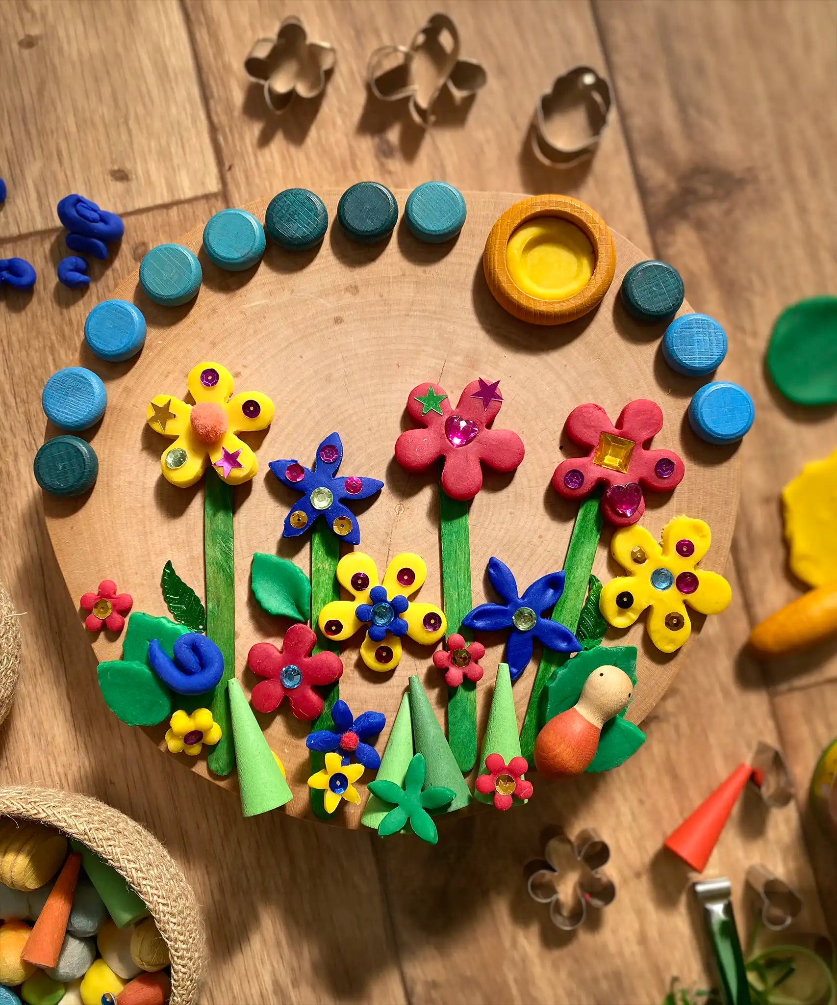 Flowers created using the OkoNorm play dough decorated with Grapat mandala pieces.