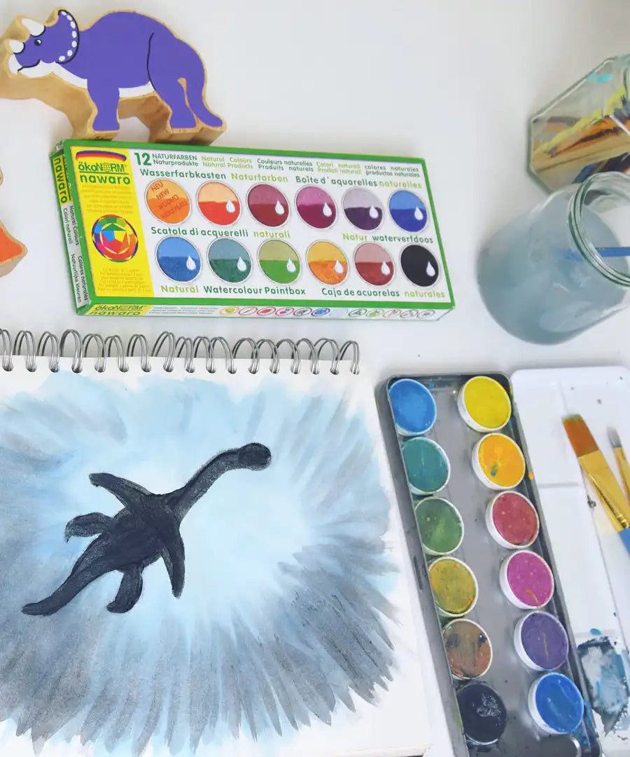Watercolour dinosaur shadow painting created using the Okonorm 12 colour watercolour paints in a travel tin.