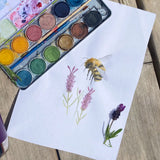 Watercolour bee and lavender painting created using the Okonorm 12 colour watercolour paints in a travel tin.