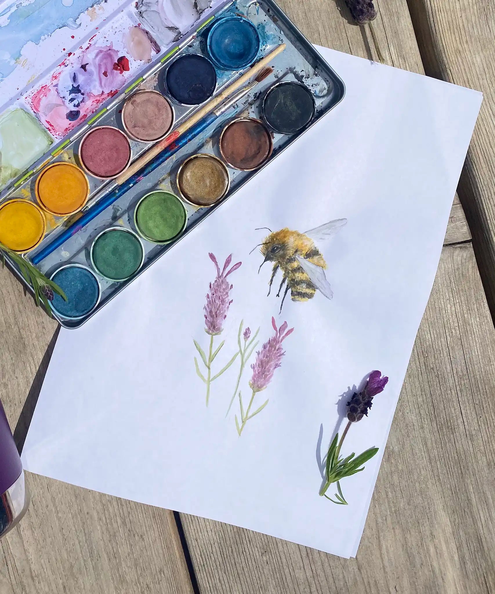 Watercolour bee and lavender painting created using the Okonorm 12 colour watercolour paints in a travel tin.