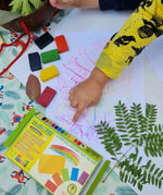 Children creating leaf rubbings with the Okonorm wax blocks from the 12 pack of rainbow colours.