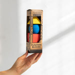 Hand holding a box of Oli & Carol X Bauhaus Movement Floating Geometric Blocks