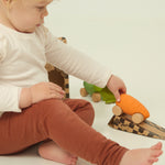 A child playing with the Oli Carol Rubber Cars