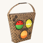 Oli & Carol Fruit Salad Baby Sensory Balls including a watermelon, lemon and tangerine in their cardboard basket shaped packaging