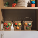 Three Packets of Oli & Carol Baby Sensory Balls, Fruit Salad, Veggie Salad and Veggie Soup placed on shelving with other Oli and Carol toys above them