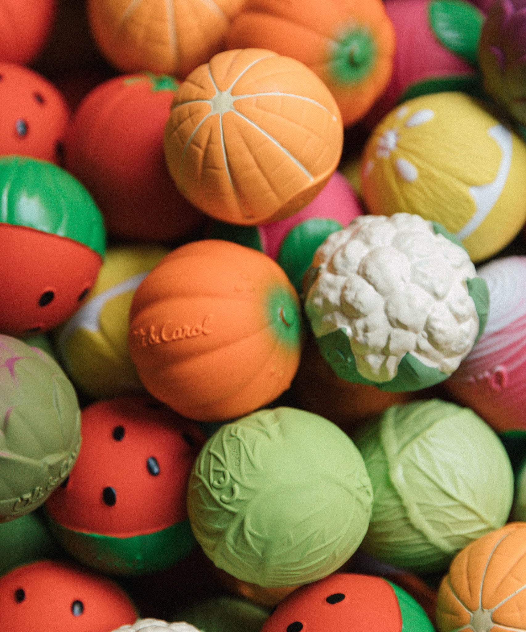 A collection of mixed fruit and vegetable Oli & Carol Baby Sensory Balls 