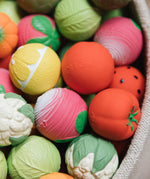 A collection of Oli & Carol fruit and vegetable baby sensory balls 