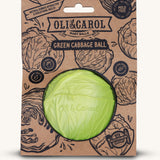 The Oli & Carol Natural Rubber Baby Ball - Green Cabbage in it's card packaging sleeve on a plain background.