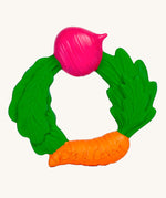 The Oli & Carol Natural Rubber Veggie Teething Ring on a plain background. 