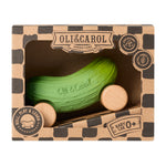 A closer look at the texture on the Oli & Carol Pepino The Pickle Baby Car. A fun green pickle car with a with wooden wheels on a white background
