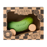 A closer look at the texture on the Oli & Carol Pepino The Pickle Baby Car. A fun green pickle car with a with wooden wheels on a white background