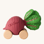 Oli & Carol Betty The Beetroot Baby Car. A fun purple beetroot car with a green leafy top, and wooden wheels on a cream background