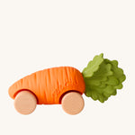 Oli & Carol Cathy The Carrot Baby Car. A fun orange carrot car with a green leafy top, and wooden wheels on a cream background