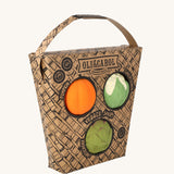Oli & Carol Vegetable soup Baby Sensory Balls in their basket shaped cardboard packaging, a pumpkin, cauliflower and an artichoke. 