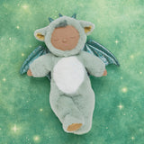 Olli Ella Ash cozy dragon dinkum doll posing against a green dreamy starry background.