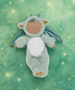 Olli Ella Ash cozy dragon dinkum doll posing against a green dreamy starry background.
