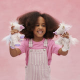 Child playing with both the pink and lilac baby unicorn toys